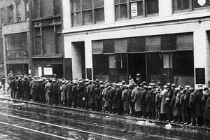 Unemployed men wait in long lines for bread and handouts during the Great Depression